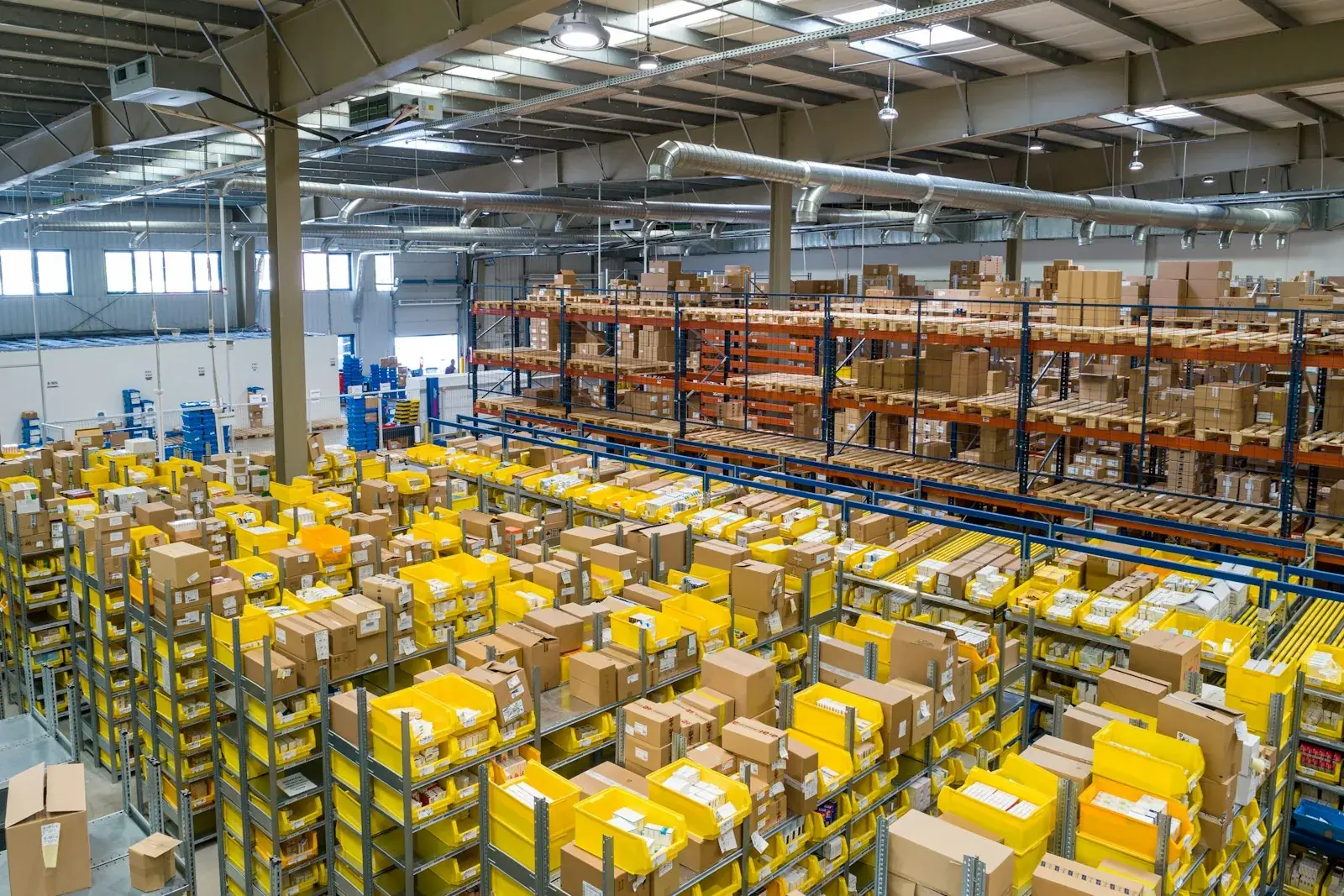 Forklift moving pallets in a distribution center